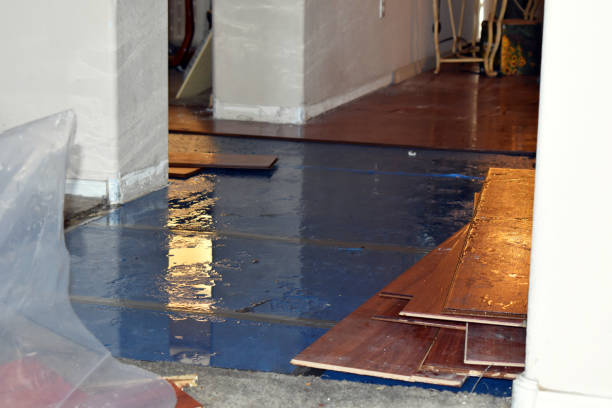 Professional Flood Damage Restoration technician working in Frederic, WI